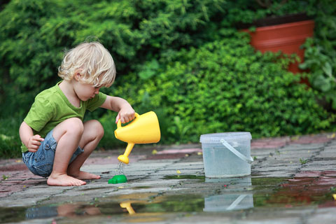 boy with watering can